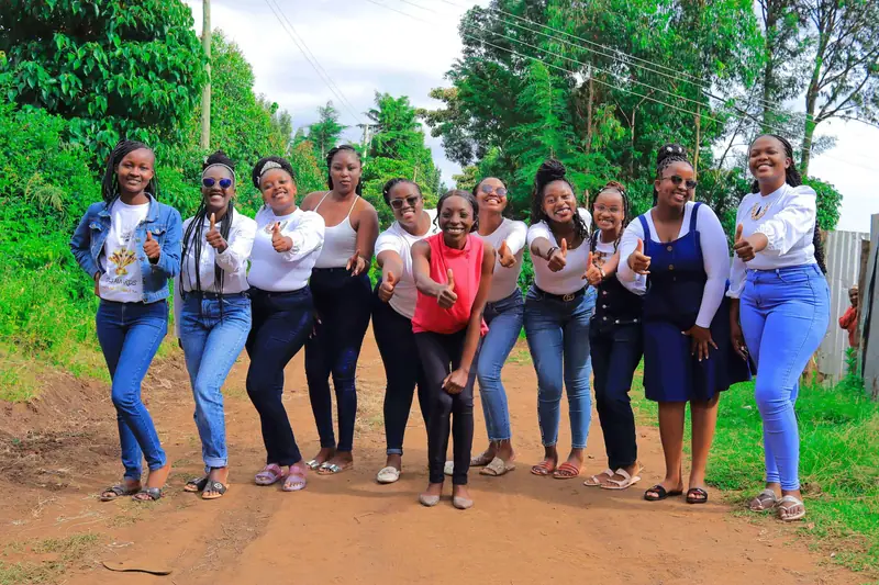 Group of friends posing together for an outdoor photo shoot